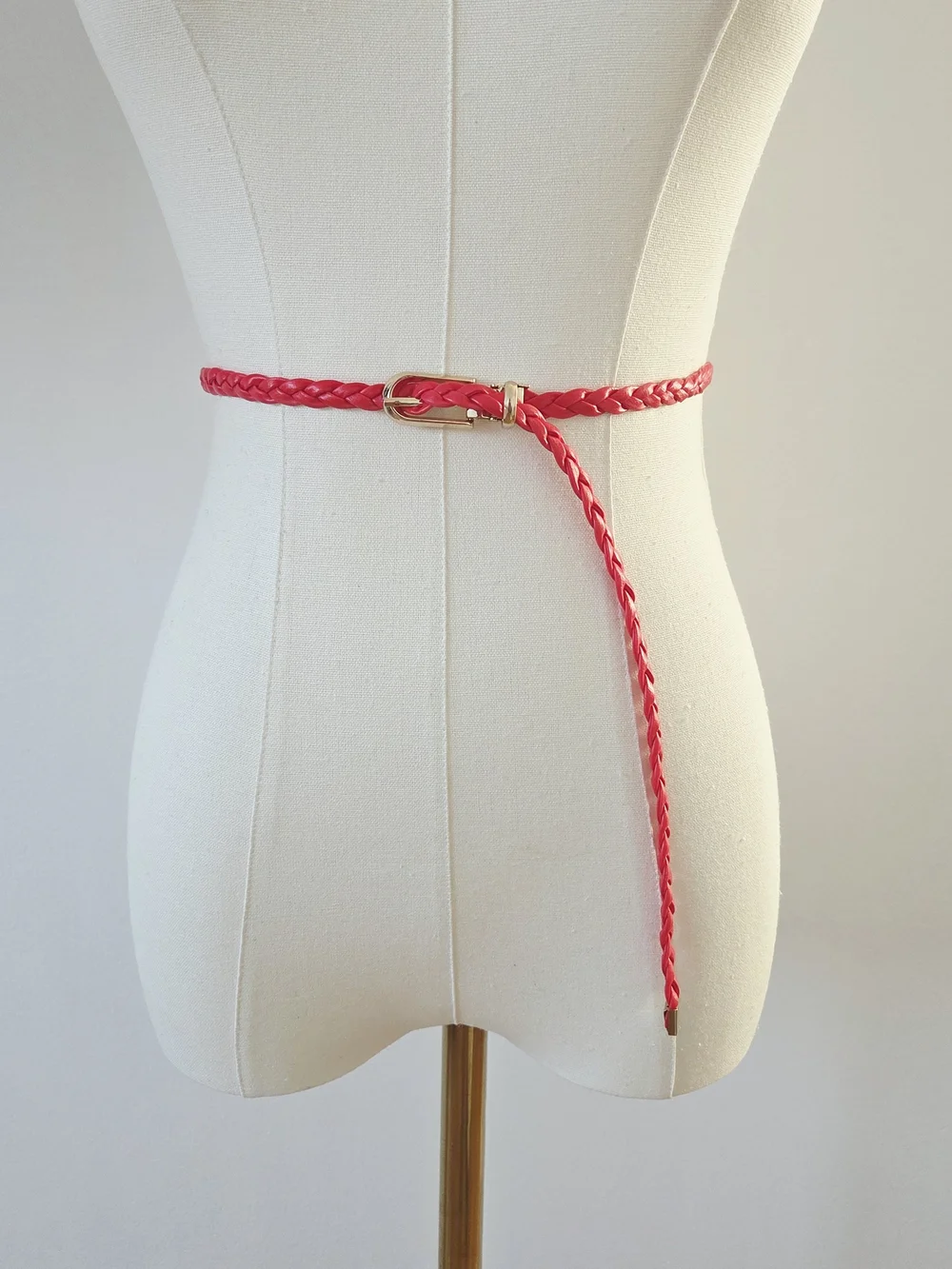 Red braided belt with gold buckle
